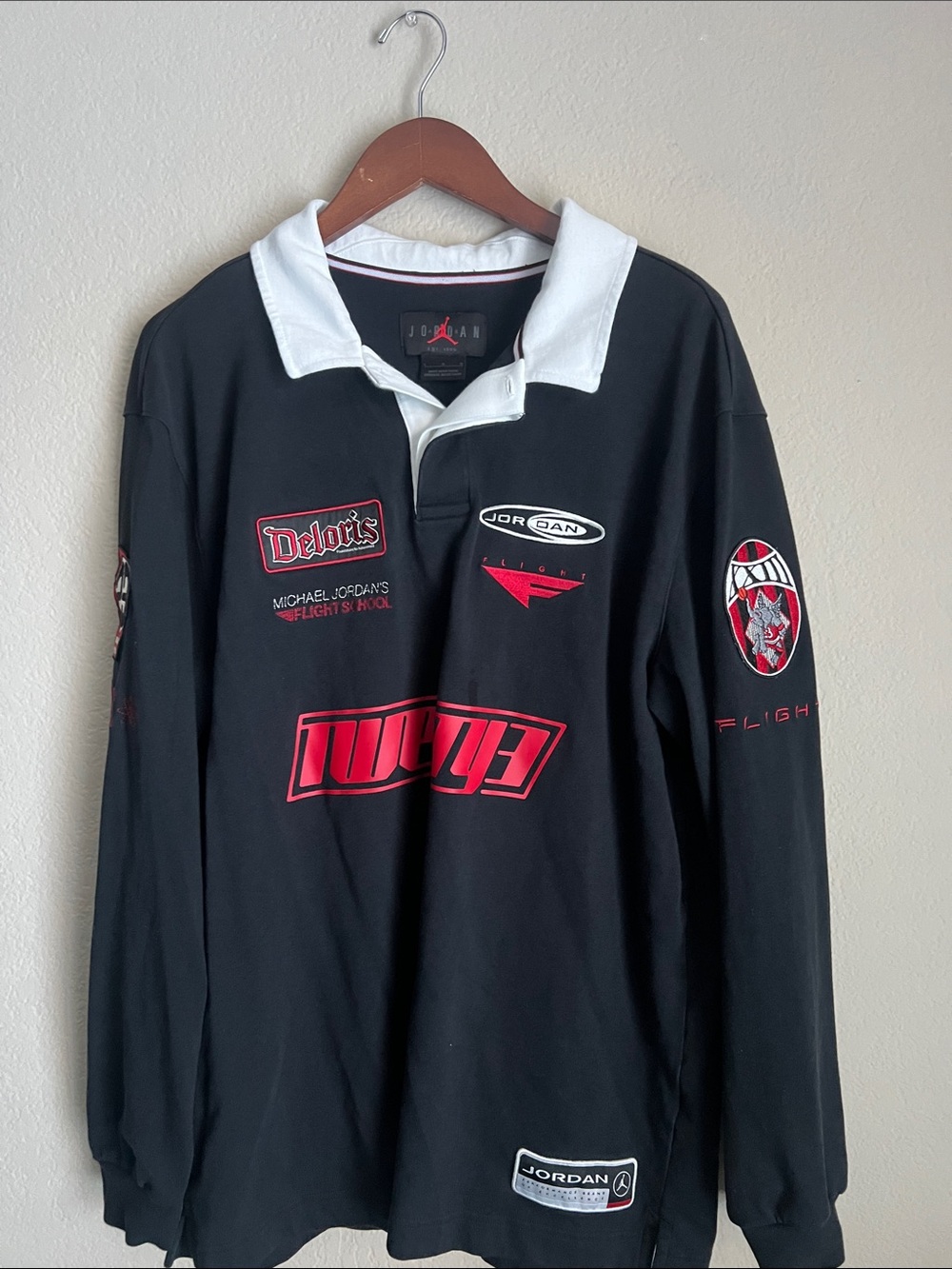 Jordan Black Long-Sleeve Rugby Shirt with White Collar and Red Graphics